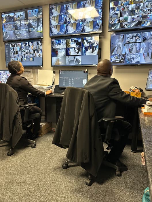 BISS control room operators monitoring live camera feeds