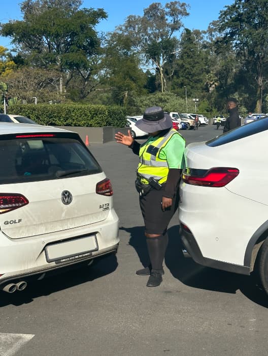 BISS officer marshalling traffic in a client parking area